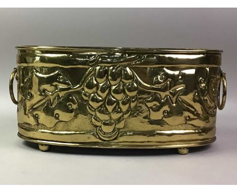 ARTS & CRAFTS BRASS PLANTER, the sides embossed with fruit and foliage37.2cm long