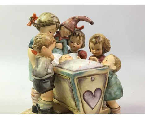 HUMMEL FIGURE OF ROCK-A-BYE, marked to base18.7cm highAppears to be in a good overall condition with no obvious damage,  woul