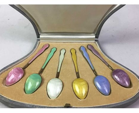 SET OF ART DECO SILVER AND HARLEQUIN ENAMEL COFFEE SPOONS, IN ORIGINAL FITTED CASE the spoon backs and handles in coloured en