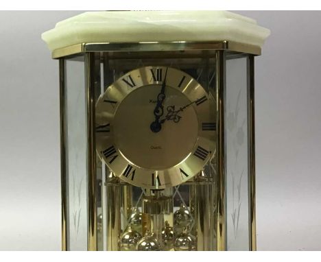 KUNDO QUARTZ ANNIVERSARY CLOCK, with brass face and Roman numerals24cm high