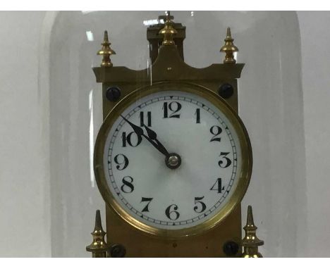 GUSTAV BECKER, BRASS ANIVERSARY CLOCK with glass dome and stepped circular base, along with a brass and copper model miniatur