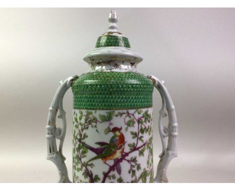 SITZENDORF PORCELAIN TWIN HANDLED VASE, decorated with perched birds, among flowers, complete with finial topped lid, the twn