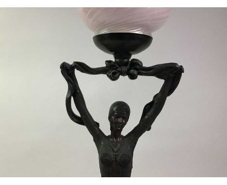 ART DECO FIGURAL LAMP, modelled as a woman, with a cranberry glass shade72cm highQty: 2Shade has no cracks or damage