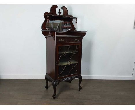 EDWARDIAN MAHOGANNY CABINET, with finial and scroll top, on cabriole legs152cm high