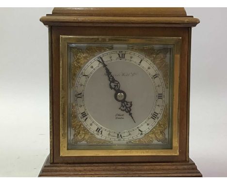 SMALL MANTEL CLOCK, BY ELLIOTT retailed by Mappin &amp; Webb, with brass carrying handle20cm highThe clock is ticking and app