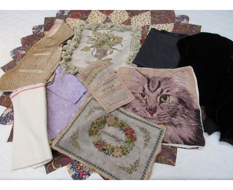 Three small boxes of various fabric remnants, two tapestry cushions  two remnants of black silk velvet and a bead work and ta