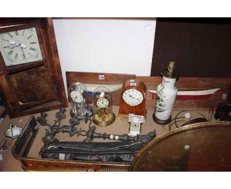 A quantity of collectables to include various mantel clocks, table lamp.