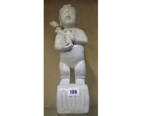 A Chinese pottery standing figure, holding vase, with child, white glazed,34cm high