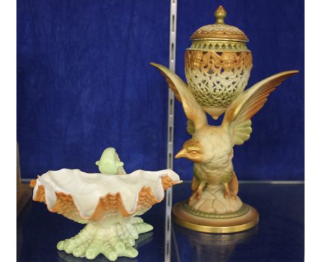 A Royal Worcester shell shaped dish, no. 324 and a Royal Worcester Parian reticulated pot pourri and cover of egg form suppor