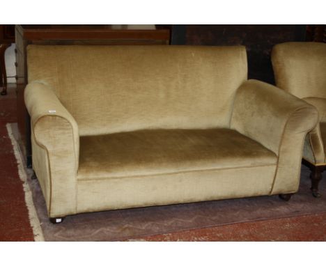 A late Victorian upholstered two seater sofa 