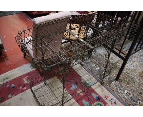 An Edwardian wirework planter with two tiers 106cm wide 