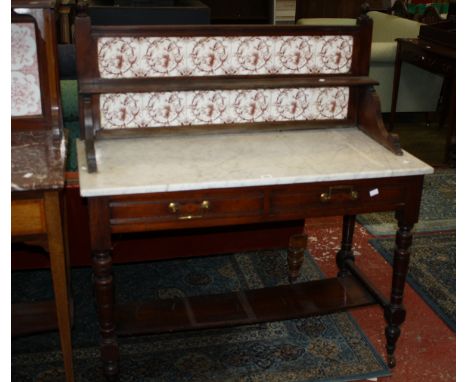 A late Victorian mahogany marble top washstand with a tile back 107cm wide 