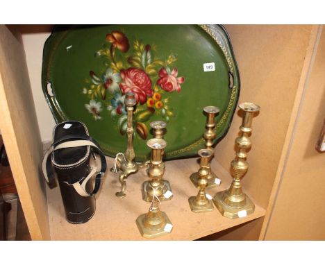 A large painted metal tray, with brass candlesticks and shelf brackets, a leather holdall and other collectable items.