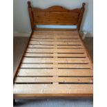 A pine 4.6ft double bed frame