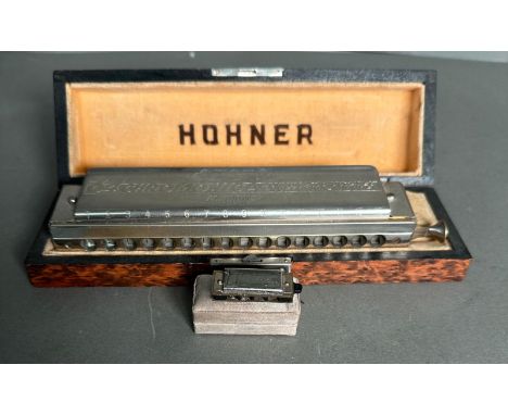 Two mouth organs, a Hohner 64 Chromonic and a Golden Curl miniatures 