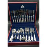A boxed silverplate six place Judge cutlery set