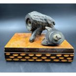 A black forest wooden novelty smoking companion of a wild boar lighter on plinth