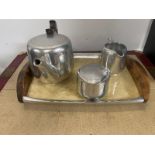 A Vintage Newmaid three piece tea service with tray to include teapot, sugar bowl and milk jug.
