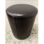 A small faux leather footstool (H43cm Dia 35cm)