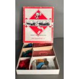 A vintage Waddington's Monopoly set with metal pieces