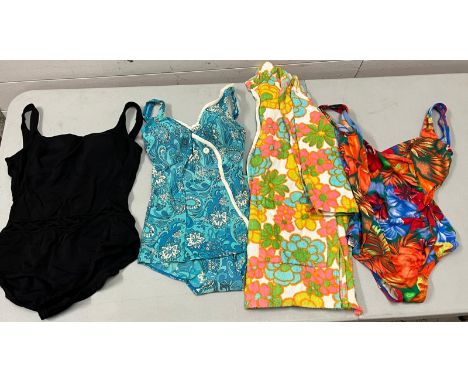 Three vintage swimming costumes and towel robe 
