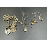 A small selection of costume jewellery including some 9ct gold earrings.