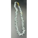 An aquamarine necklace with an 18ct gold clasp.
