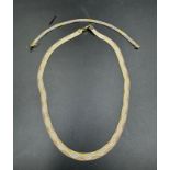 An Italian silver triple tone wave necklace and a bracelet marked 925