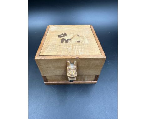 A vintage wooden Scottie dog cigarette dispenser 