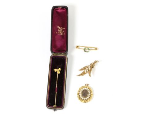 A nineteenth century mourning pendant, a central glazed locket, containing hairwork, within a border of seed pearls, to a cas