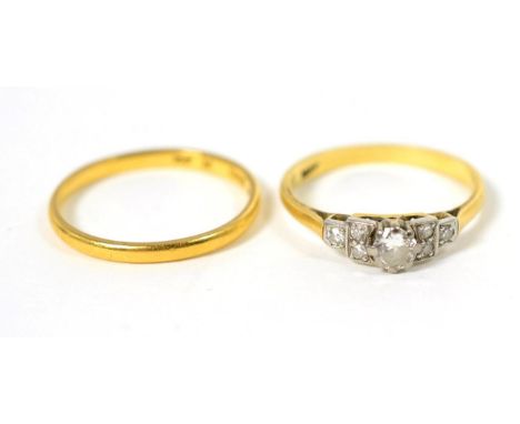 An early twentieth century solitaire diamond ring, an old cut diamond in a claw setting, to diamond set square shoulders, est