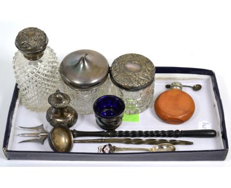 A silver topped glass scent bottle, two silver topped glass jars, silver mounted ladle and fork, a silver pepper etc