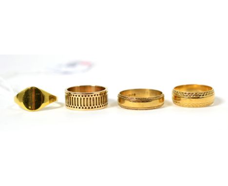 An 18 carat gold signet ring, finger size P; a 9 carat gold broad band ring, with lattice motif, finger size N and two other 