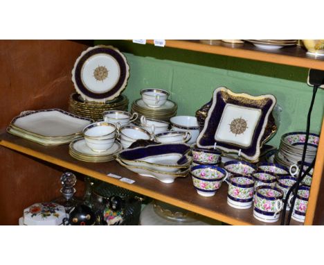 A Paragon china part dessert service, white ground with cobalt blue borders and gilt embellished, comprising twelve plates an