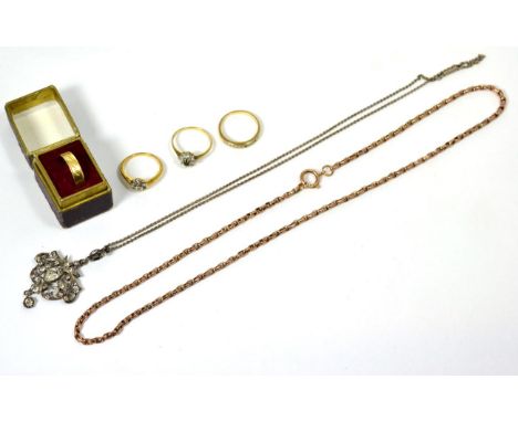 An 18 carat gold ring; three rings; a chain; and a pendant 