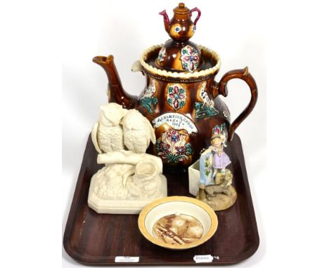 A large Measham Ware barge teapot and cover labelled E Champion, Upton, A.H.C. 1886 (a.f.); an Old Bill small dish; a Parian 
