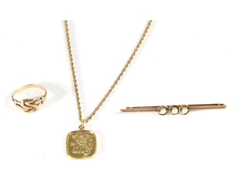 A 9 carat gold rampant lion pendant on chain, measures 2cm by 1.5cm, chain length 45cm; a Celtic knot ring, finger size M and