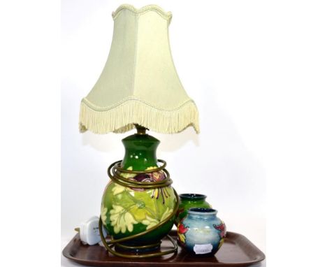 Moorcroft lamp and two matching vases 