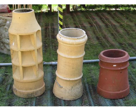 Two Victorian buff coloured clay chimney pots, one stamped Bourne Valley Pottery, Poole Dorset, together with one further ter