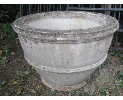 A weathered circular planter, 70cm diameter 