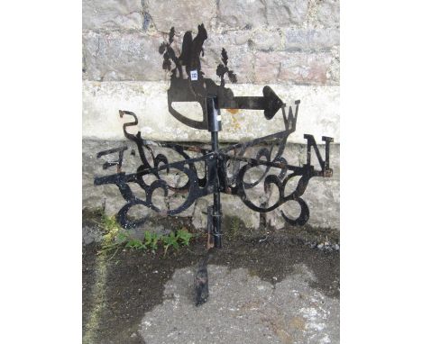 A weather vane, surmounted by a squirrel 