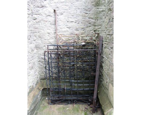 A pair of entrance gates with scrolled detail, a further pedestrian gate and a length of regency cast balustrade 