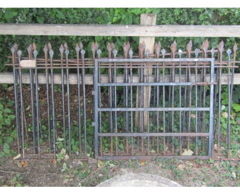 four lengths of iron spear head railings, totalling 720cm long x 90cm high, together with a simple iron gate 