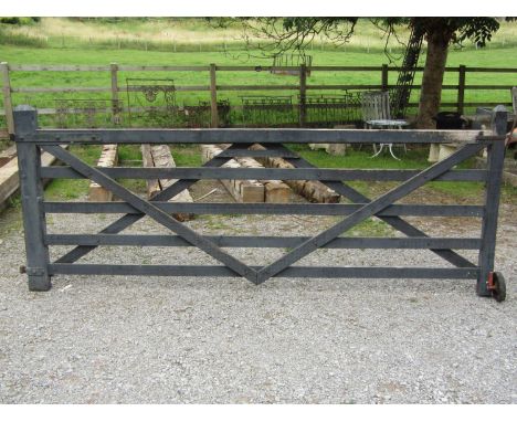 A five bar field gate in timber, with iron fittings, 310cm long approx (10ft) (dry stored) 