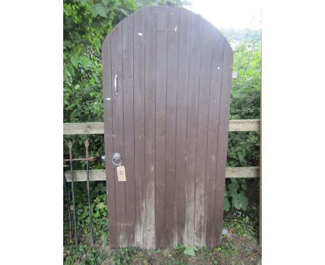 An arched pine pedestrian gate, 180cm high x 90cm wide 