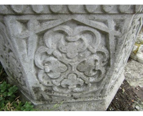 A weathered reconstituted planter of octagonal form of geometric detail, 50cm diameter 