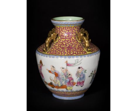   Beautifully shaped with a broad belly and narrow neck, with four gilt handles, on the body it is decorated with children pl