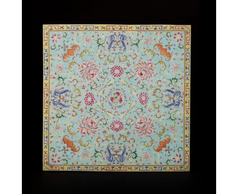   Square in shape, it is painted in famille rose enamels on a turquoise ground with a yellow border depicting stylised blue a