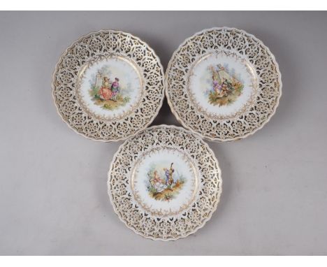A set of twelve 19th century Dresden figure pierced decorated gilt scrollwork dessert plates (two for restoration) Condition: