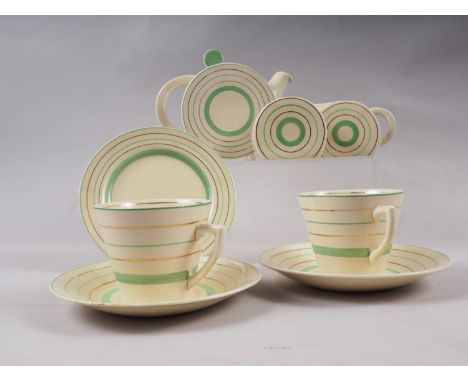 A Clarice Cliff green and gilt stripe decorated cabaret setCondition:The two saucers and side plate are all crazed, have smal